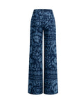 A pair of wide-leg trousers featuring a dark blue and navy floral pattern, shown against a plain white background.
