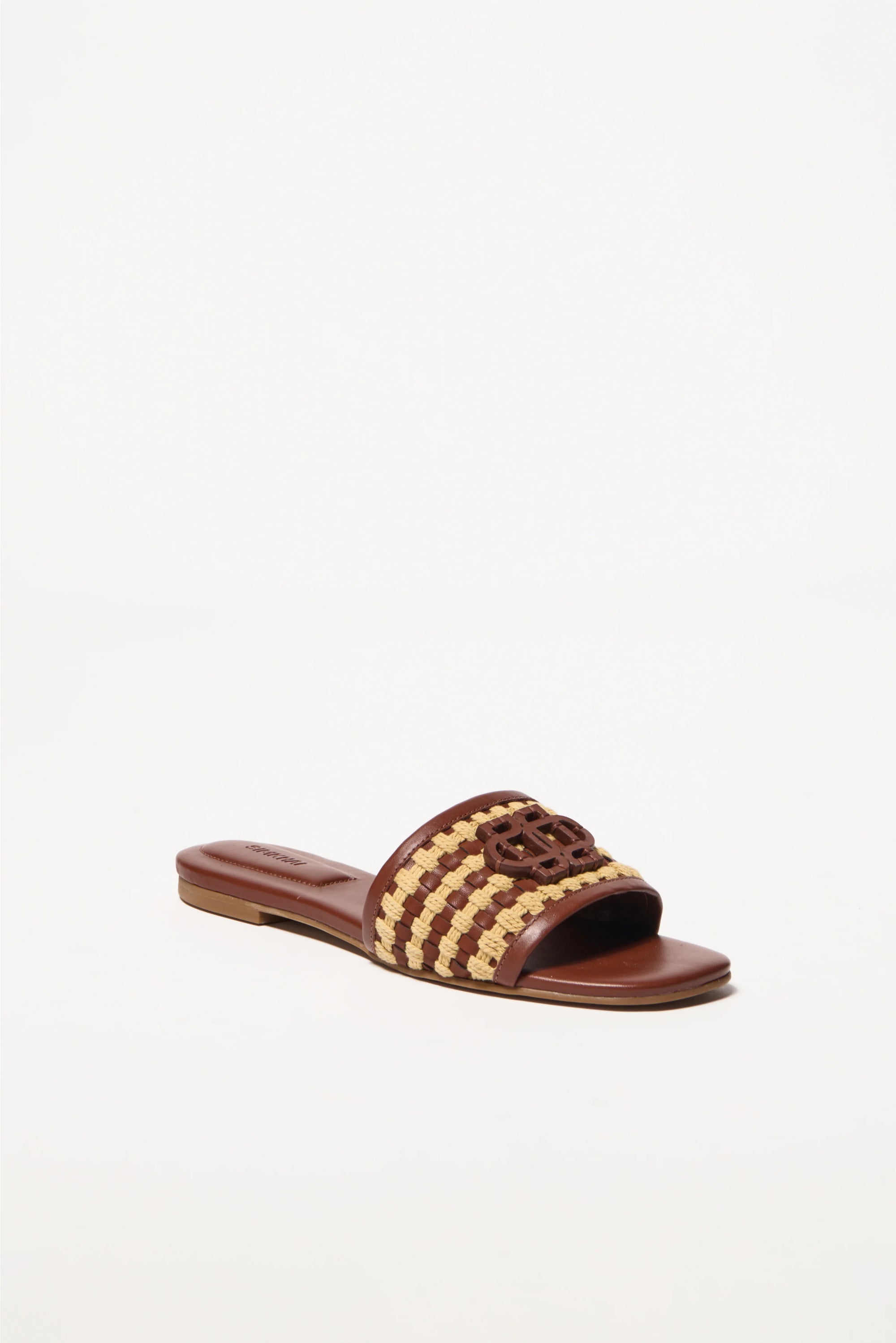 Brown slide sandal with woven design on a white background
