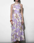 Woman wearing a floral dress with a white background