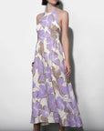 Woman wearing a floral dress with a white background