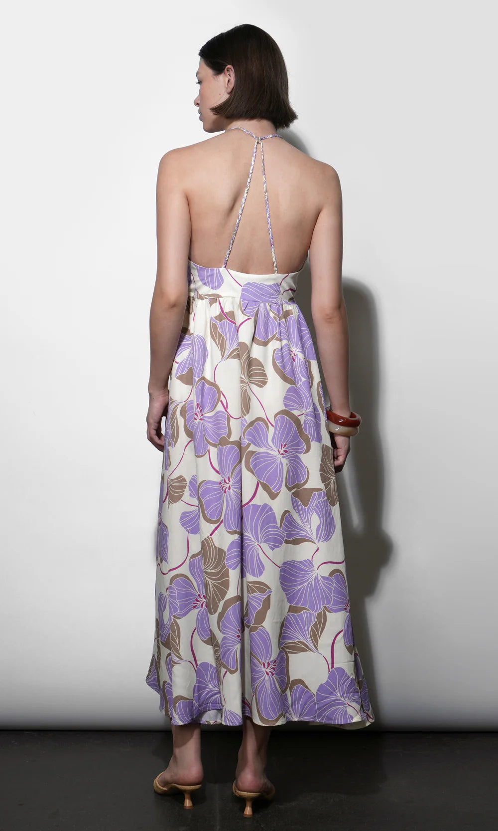 Woman wearing a floral dress with a white background