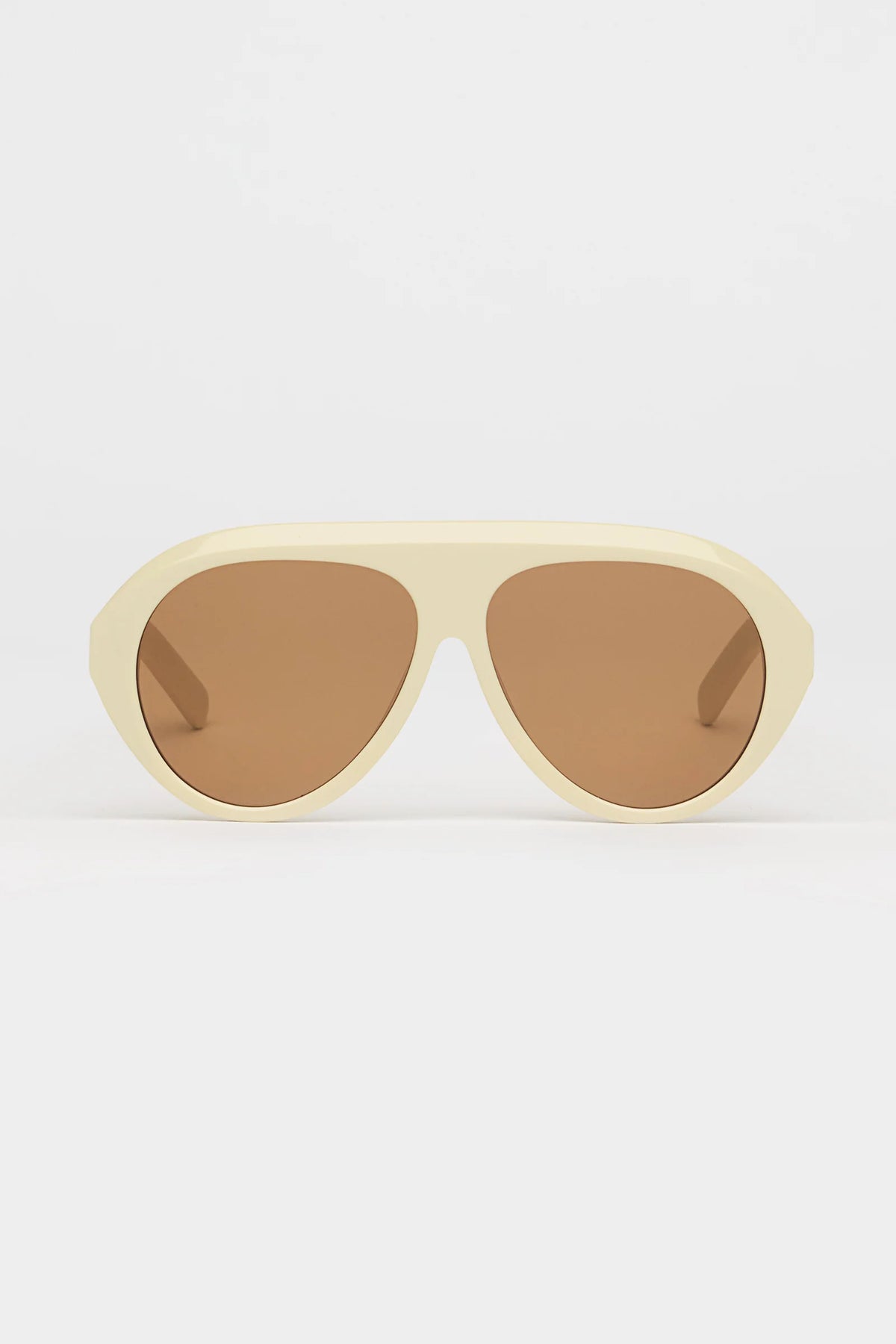 ivory sunglasses with amber lenses on a white background 
