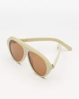 ivory sunglasses with amber lenses on a white background 
