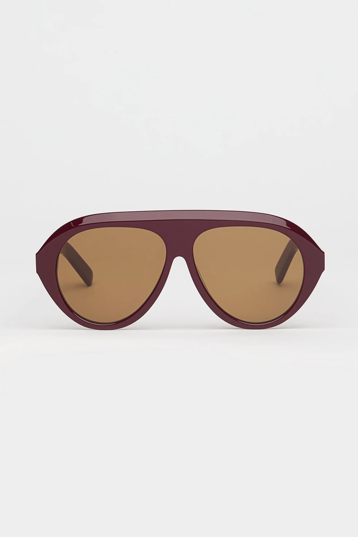 garnet oversized sunglasses with amber lenses on a white background 