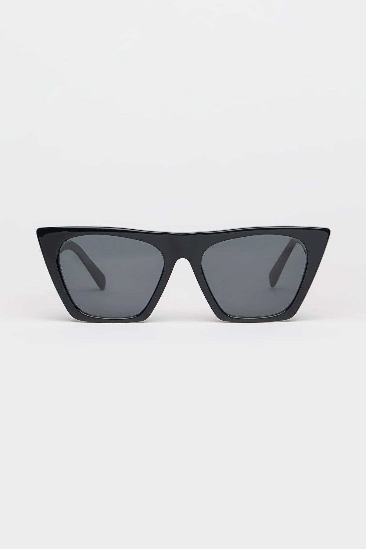 Black sunglasses with dark lenses on a white background