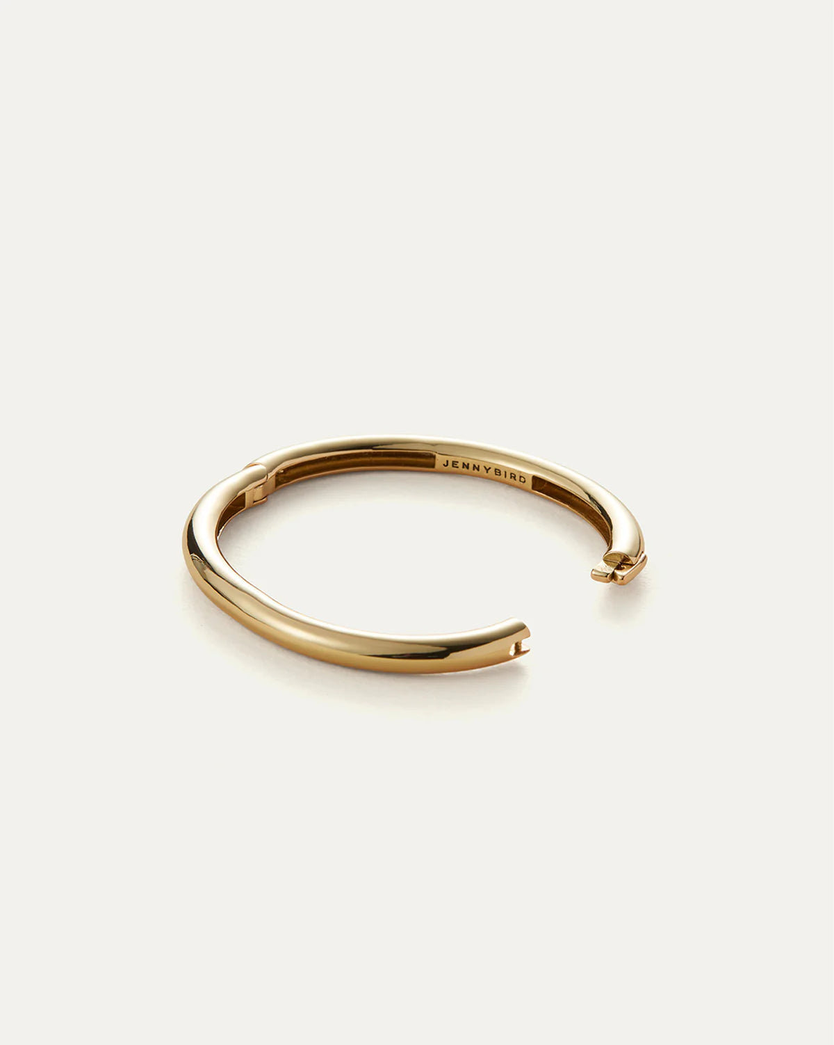 Gold bracelet on a white background