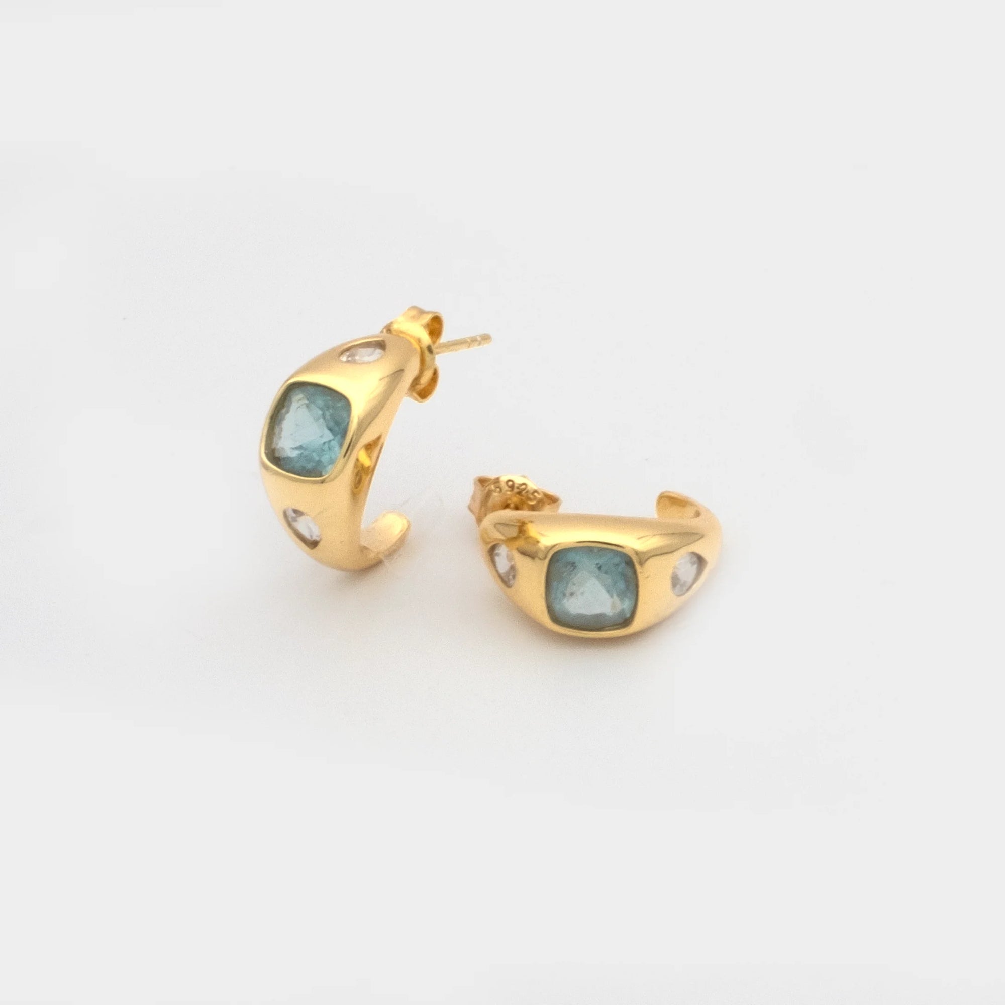 Giulia Hoop Earrings Aquamarine one earring laying down