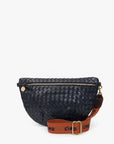 A woven leather half-moon fanny pack in navy blue with a brown webbed shoulder strap featuring the brand name 'CINO' in black, shown on a light gray background.