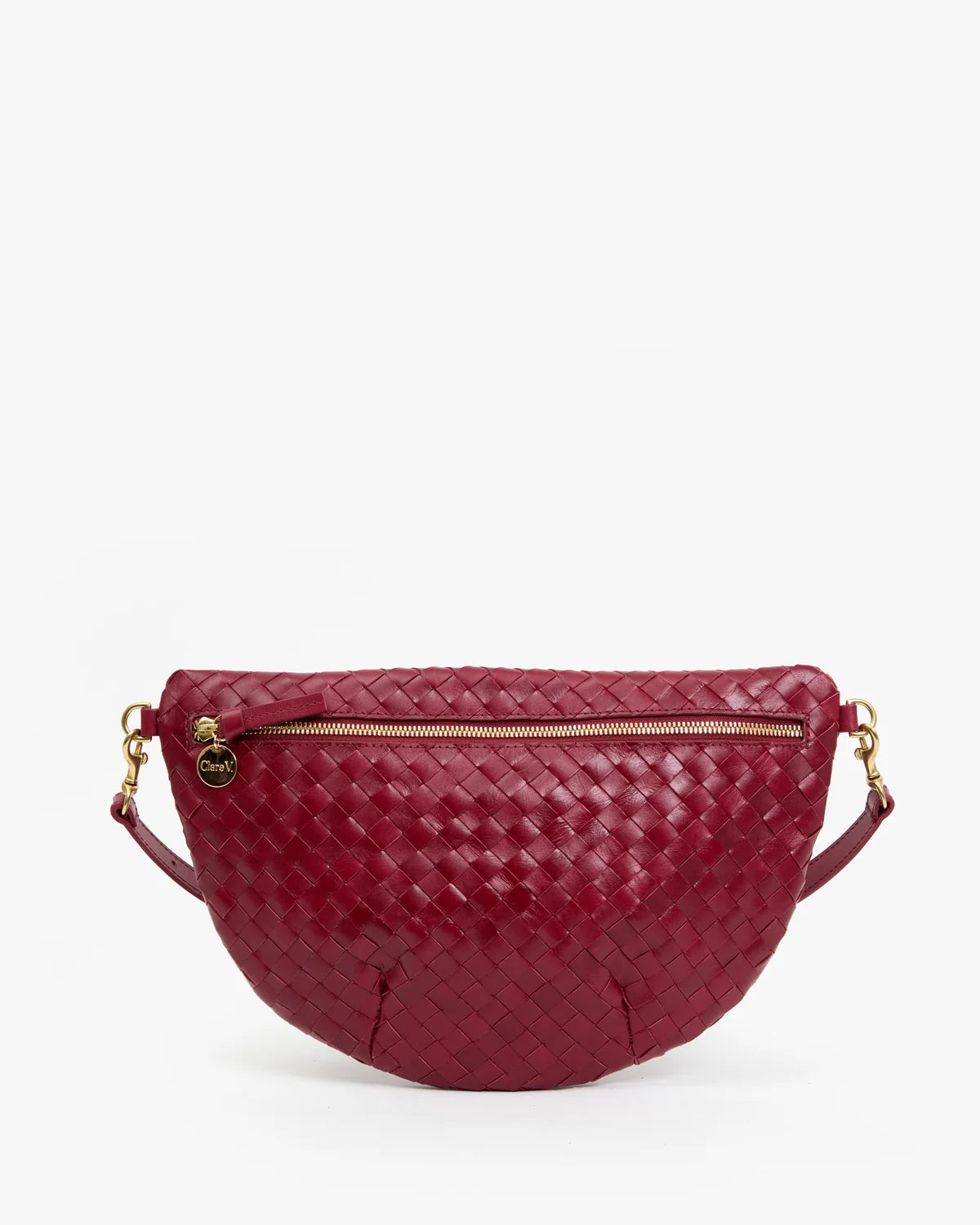 A burgundy woven leather half-moon waist bag with gold-tone hardware and a zippered front, shown against a plain white background.