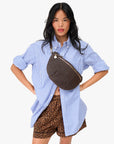 Grande Fanny in Chocolate Rattan front view on model worn as a crossbody