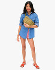 Grande Fanny in Olive Multi Woven front view on model clutching bottom of fanny bag