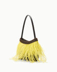 A small shoulder bag with a black leather handle, a dark brown beaded trim, and a bright yellow feather fringe, shown on a plain white background.