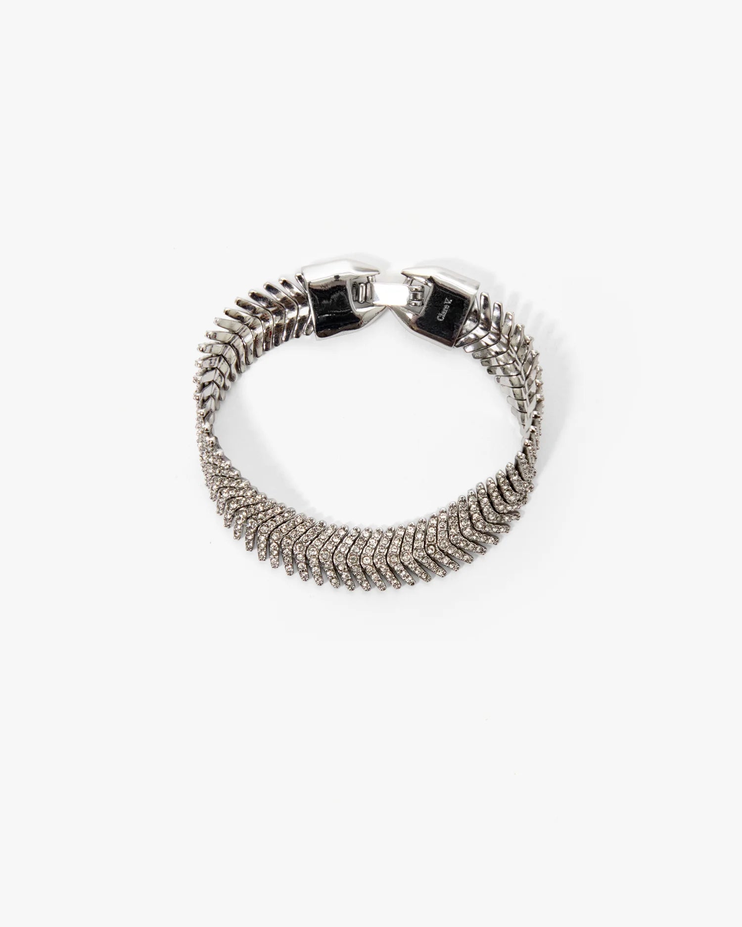 Silver bracelet with a clasp on a white background