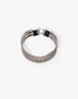 Silver bracelet with a clasp on a white background