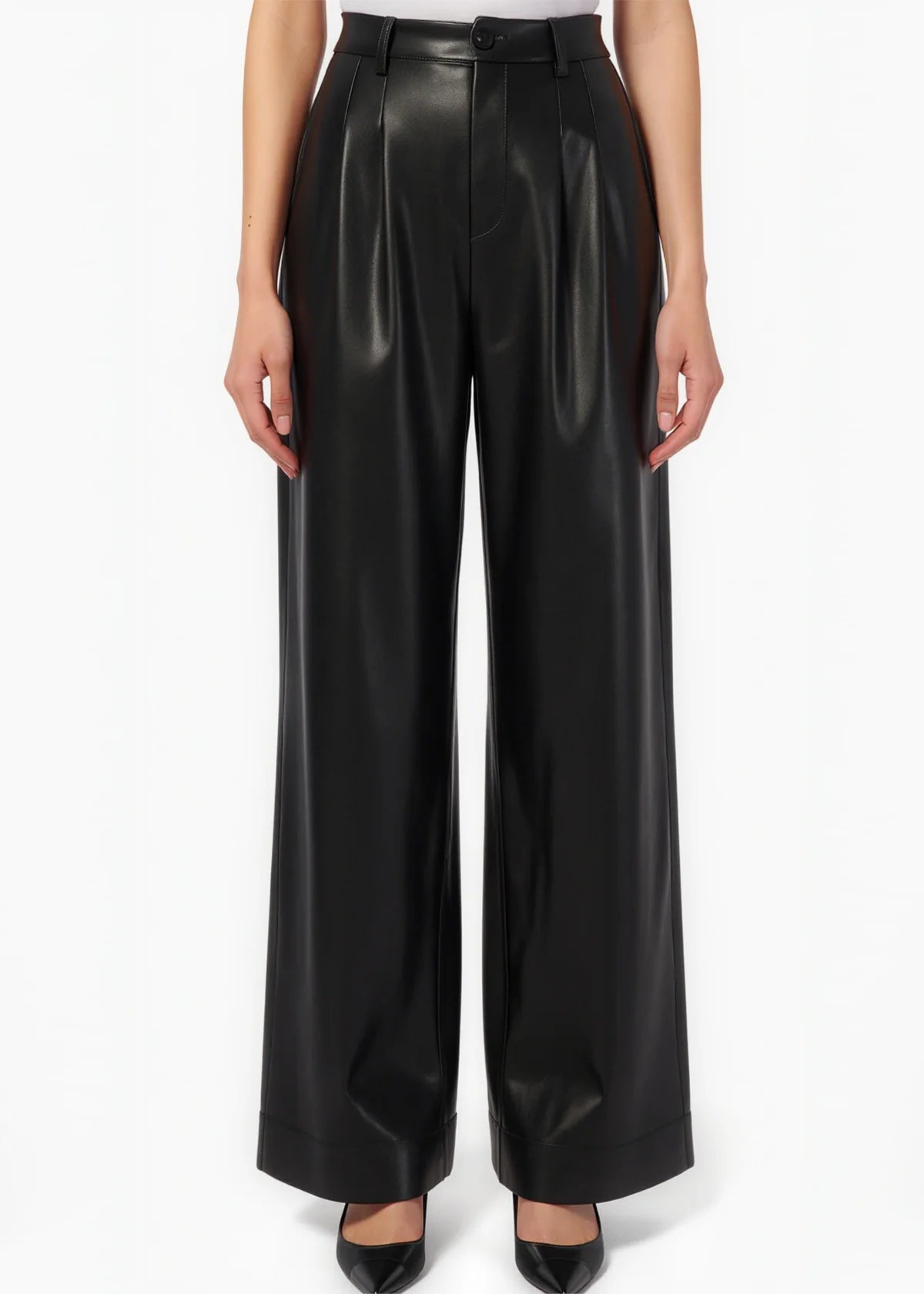 Black leather pants worn by a person on a white background
