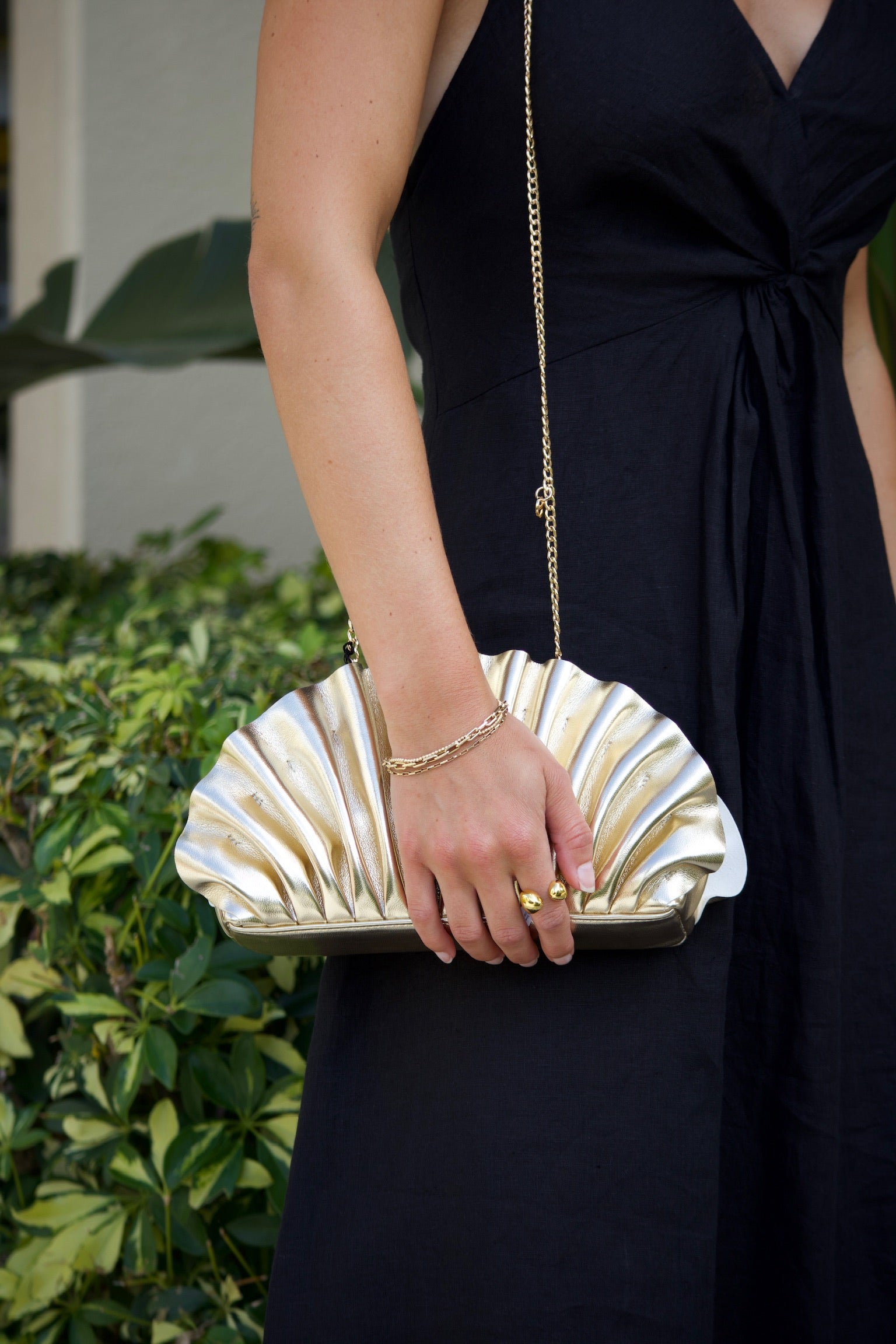 Hollie Pleated Clutch close up on model's shoulder