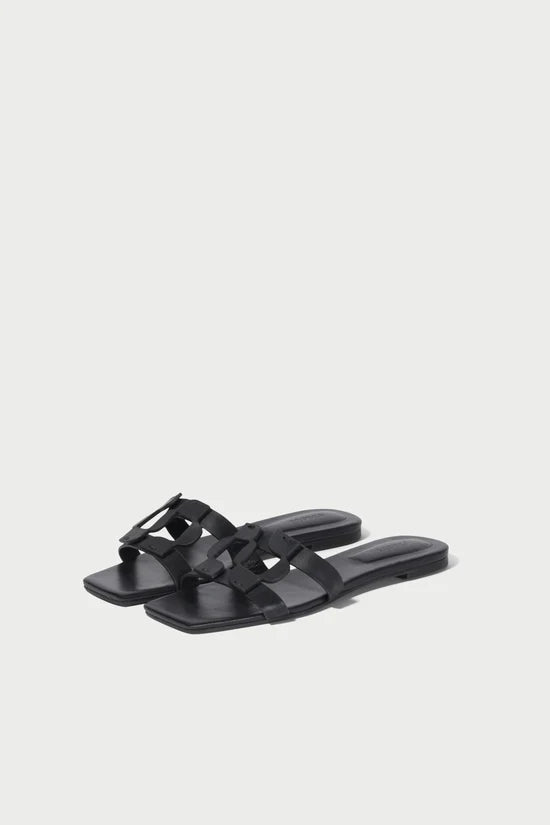 Black sandals on a light gray background
