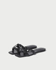 Black sandals on a light gray background