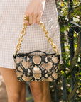 Shortie Strap Gold on snake print bag