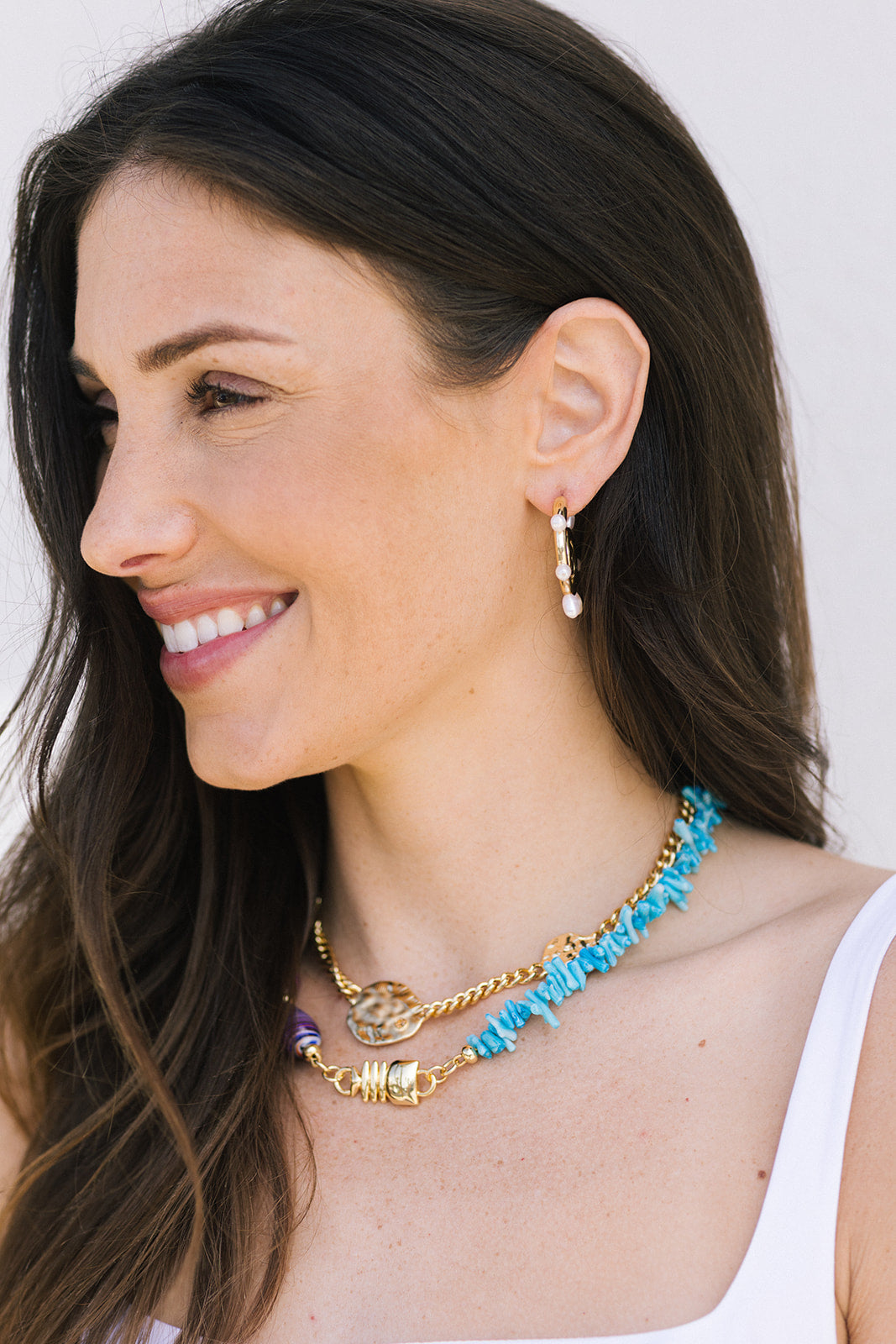 Triana Necklace and gold necklace on model