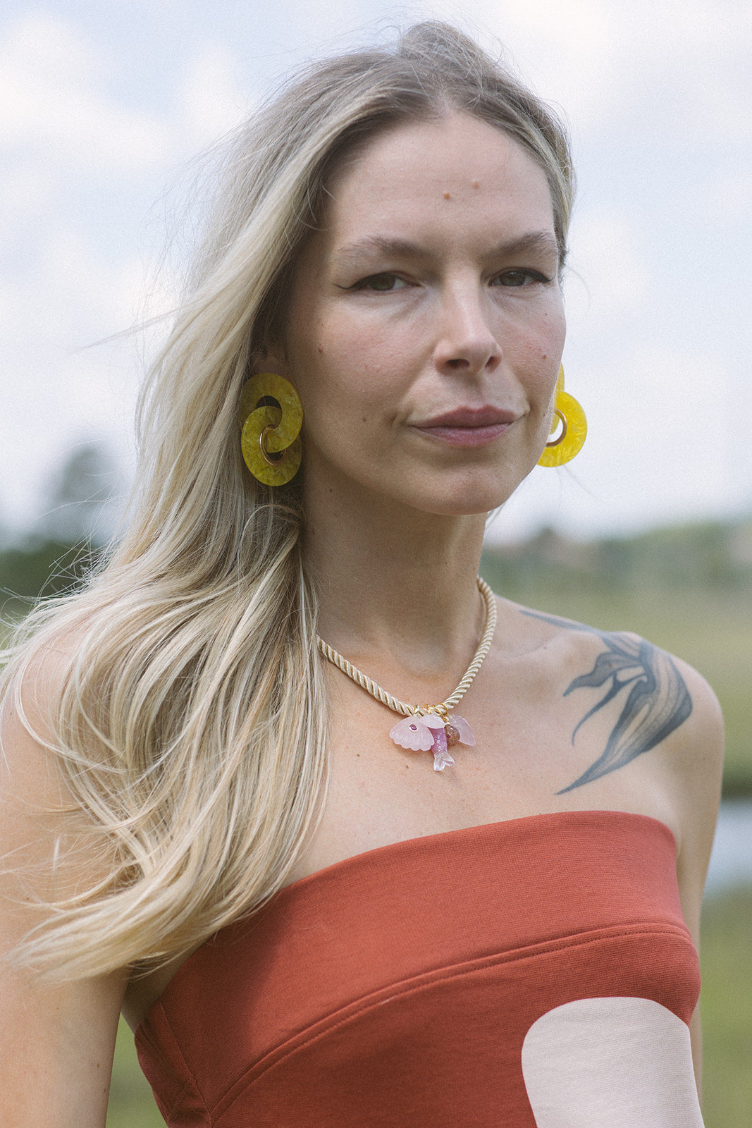 Mich Necklace with strapless dress and yellow earrings