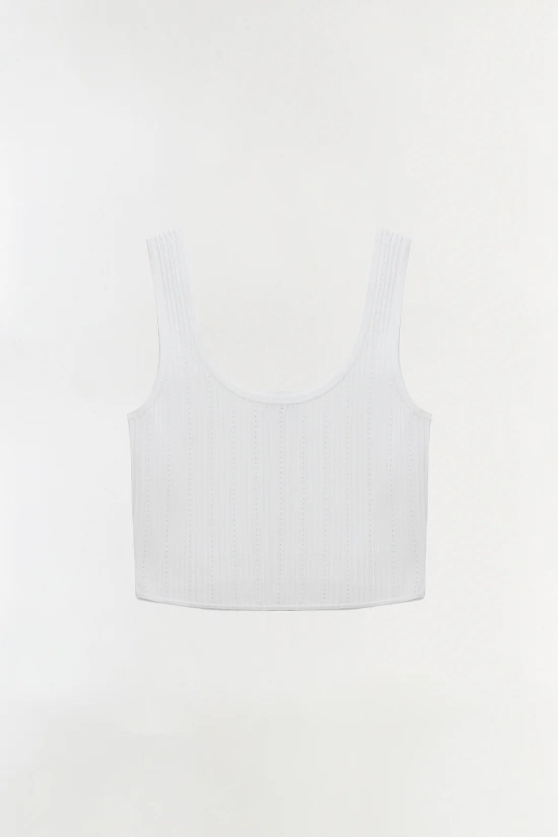 White sleeveless top on a light gray background