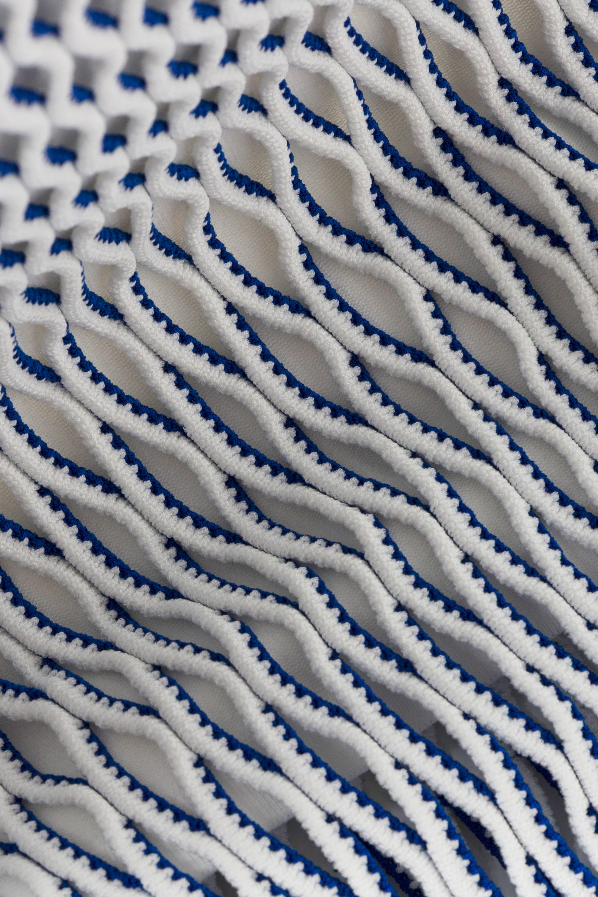 Close-up of a textured fabric with blue and white pattern