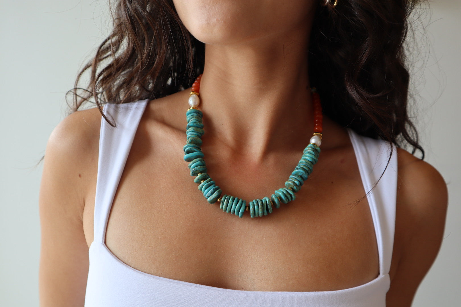Extreme close-up of Tracey Necklace on model