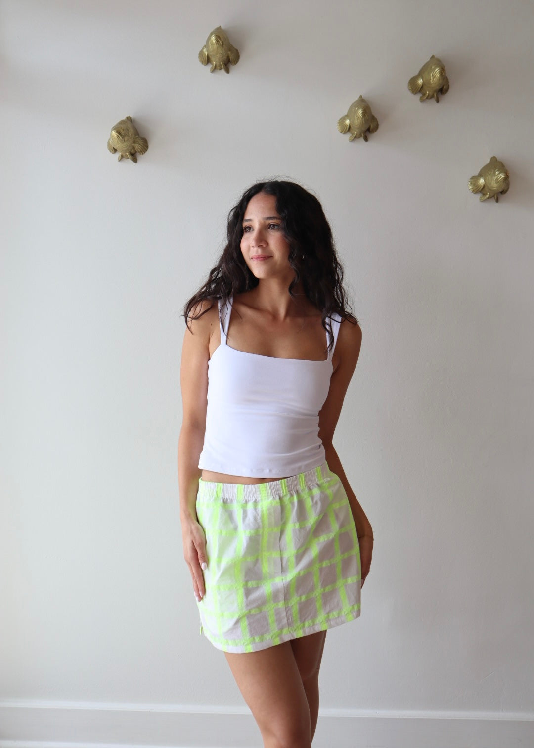 The Boxer Mini Skirt in Dayglow front view on model