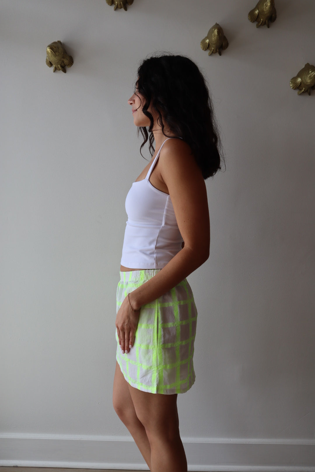 The Boxer Mini Skirt in Dayglow side view on model