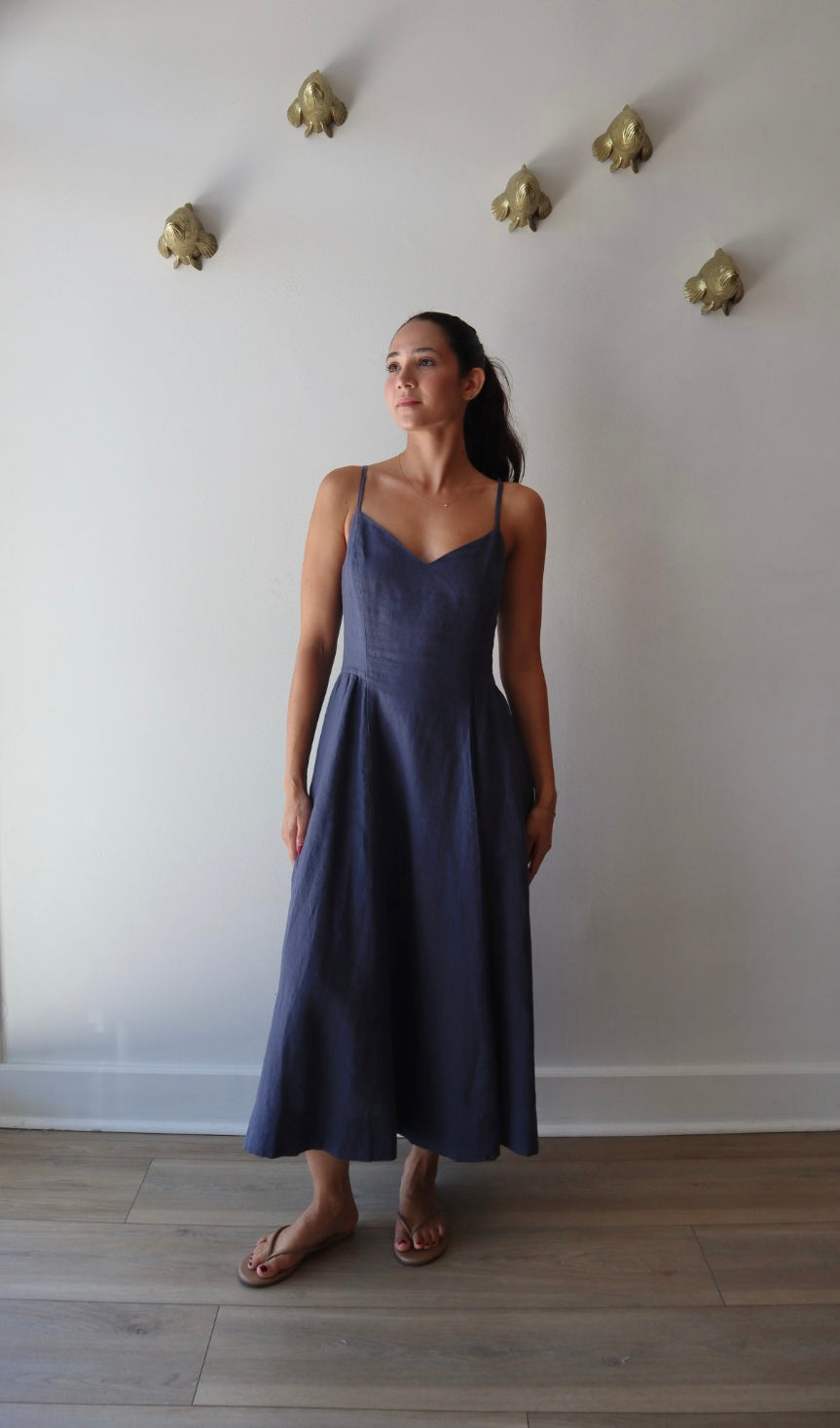 Bardot Dress in Navy full body front view on model with hands to side