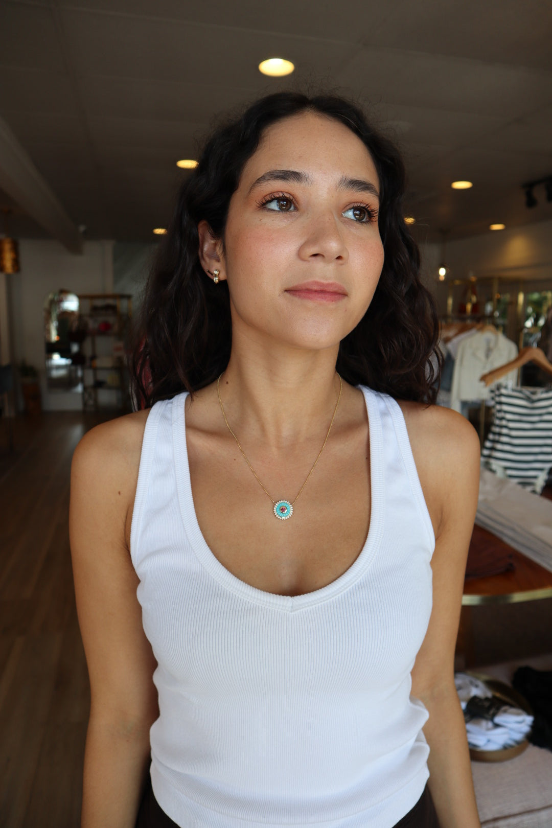 Mandala Medallion Necklace farther back view showing turquoise side on model's neck