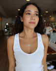 Mandala Medallion Necklace farther back view showing turquoise side on model's neck