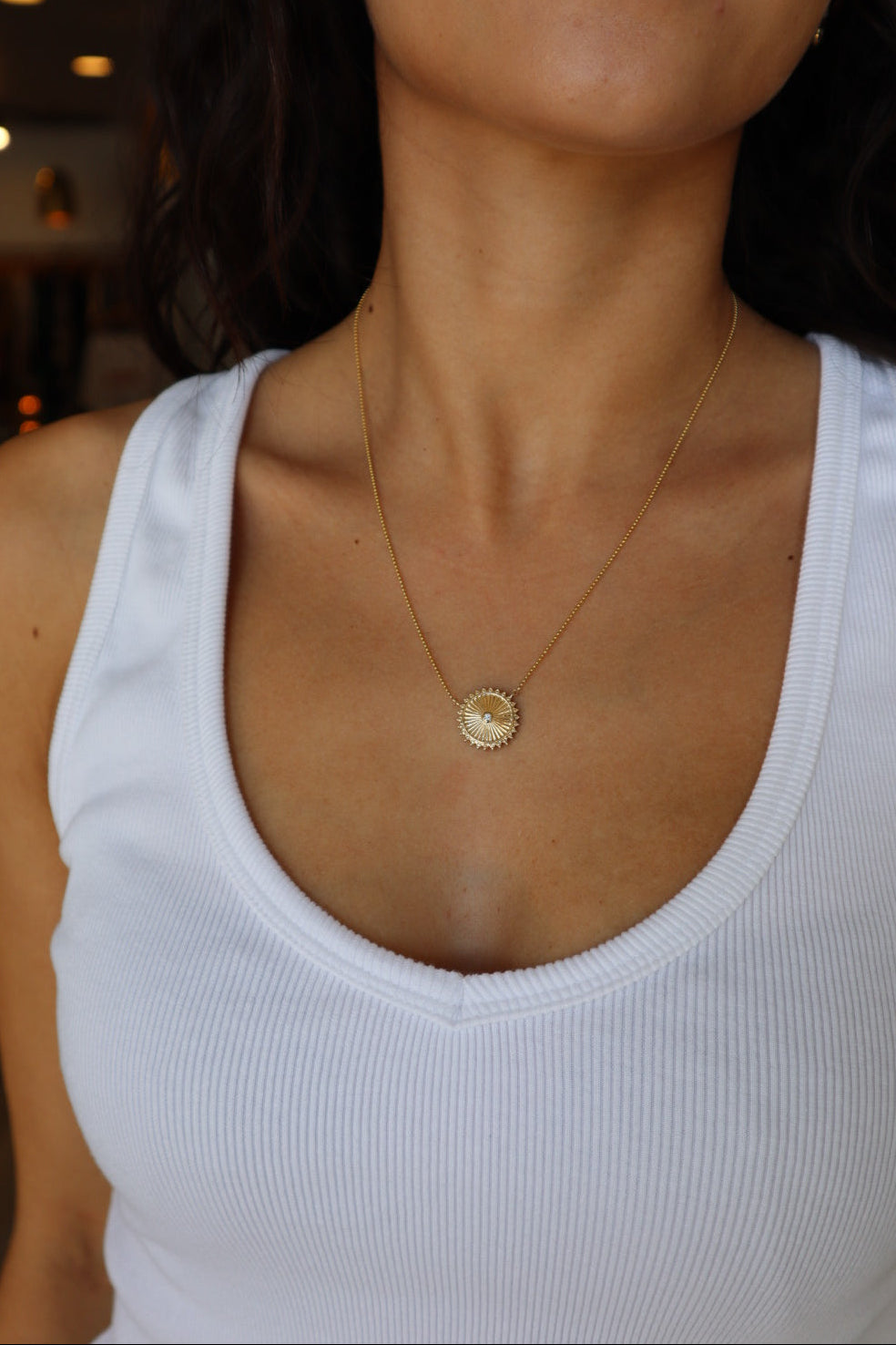 Mandala Medallion Necklace showing gold side on model's neck