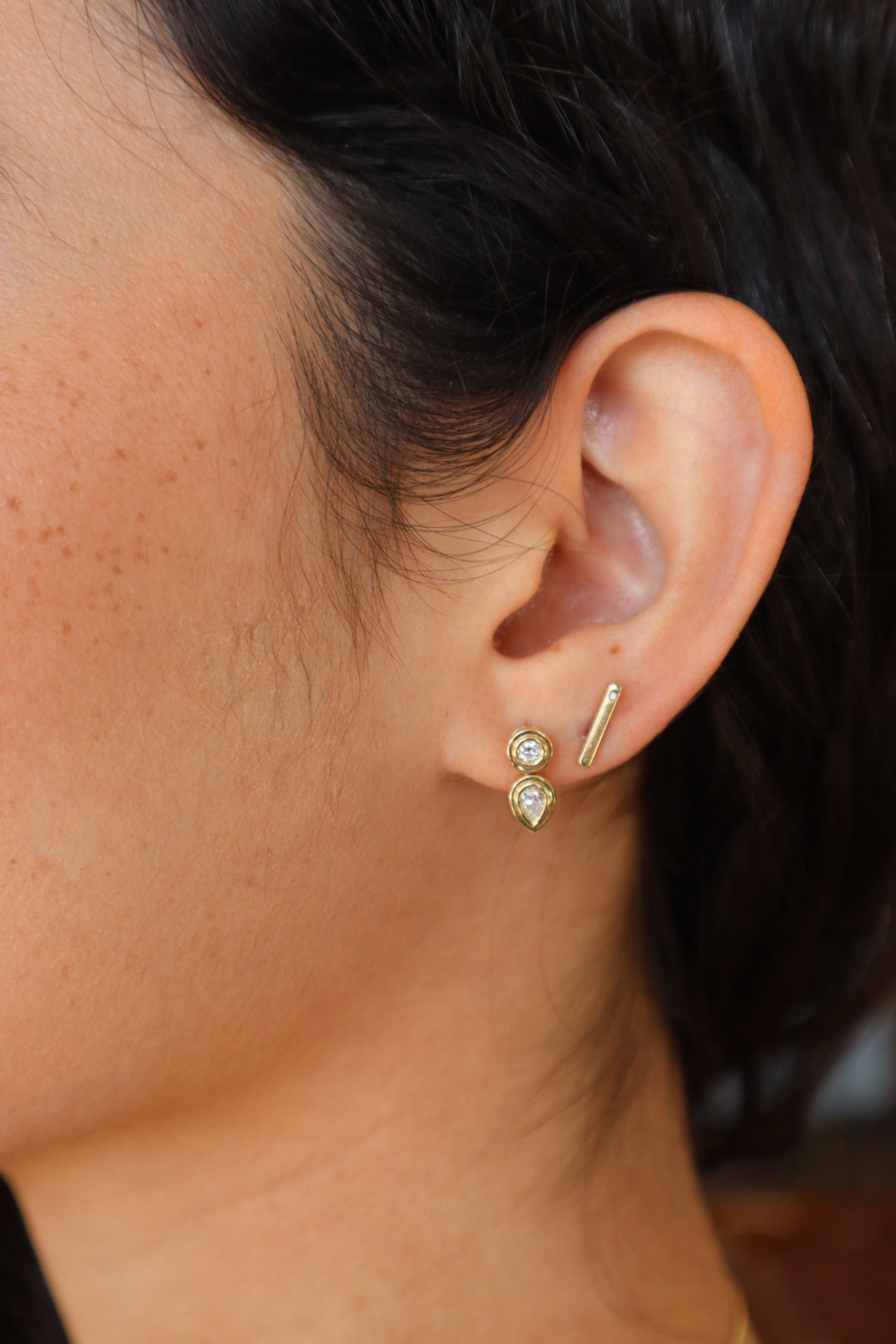 Groovy Diamond Pear Drop Earrings close up side view on model