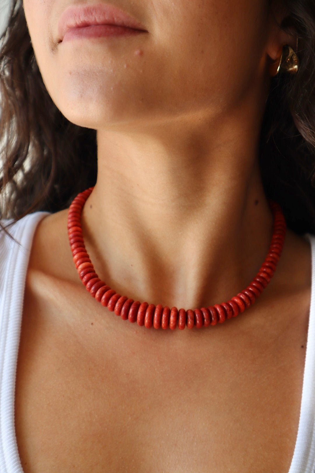 Graduated Coral Gemstone Necklace closer up front view on model