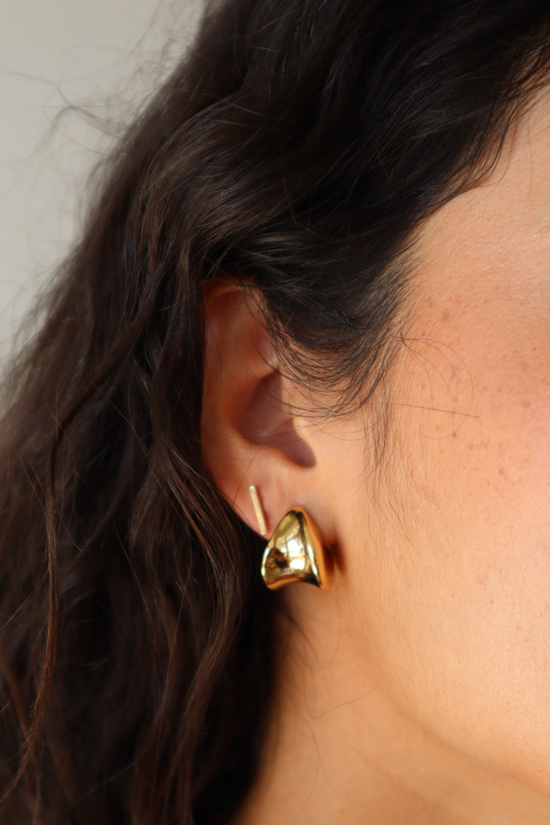 Small Margaux Puff Earrings close up front and partial side view on model