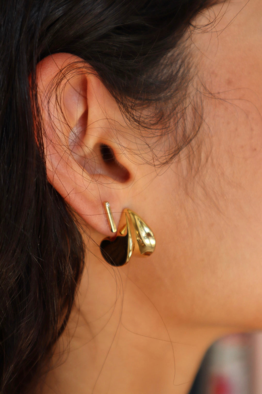 Small Margaux Puff Earrings close up side view on model