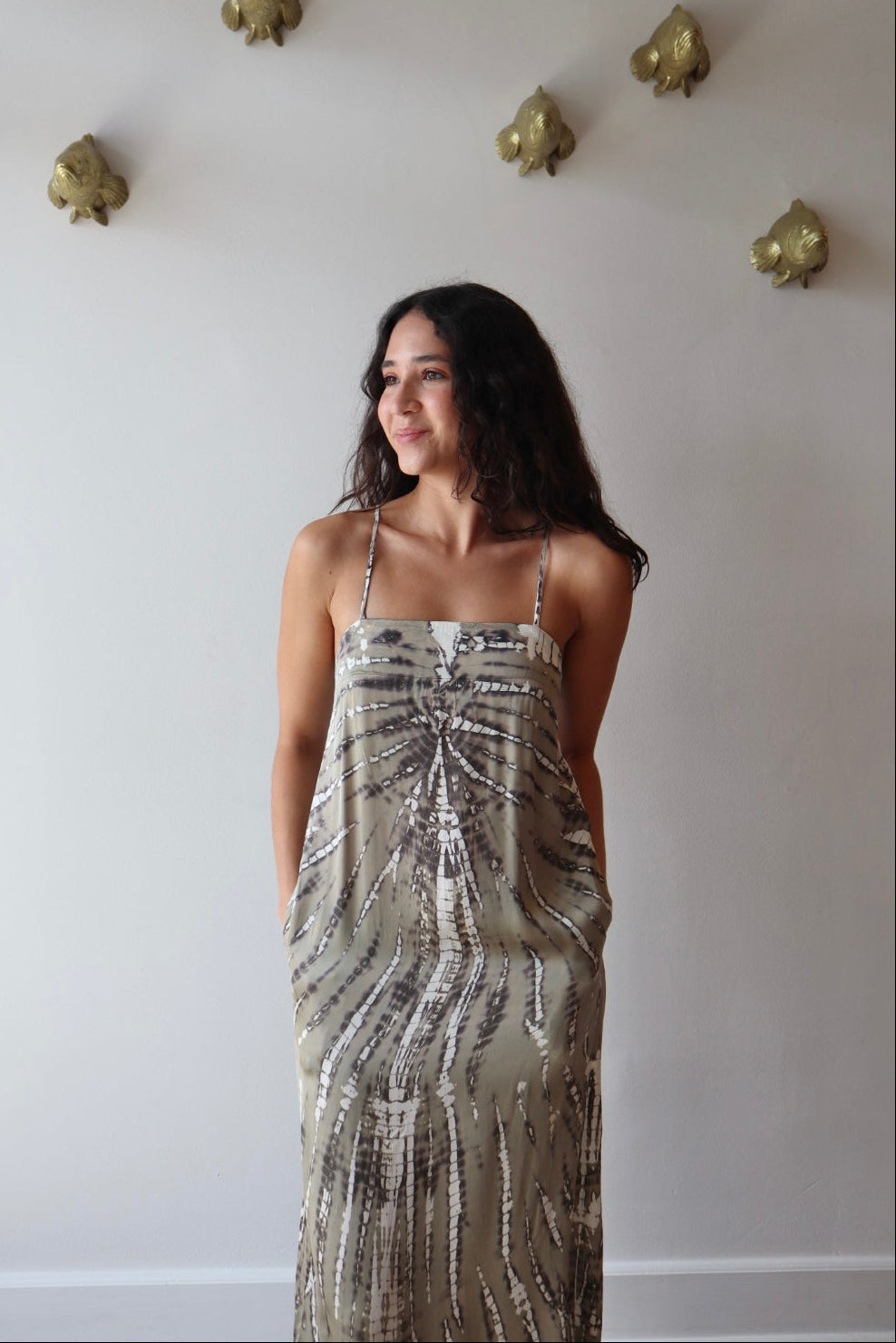 Khana Slip Dress closer up front view on model with hands in pockets