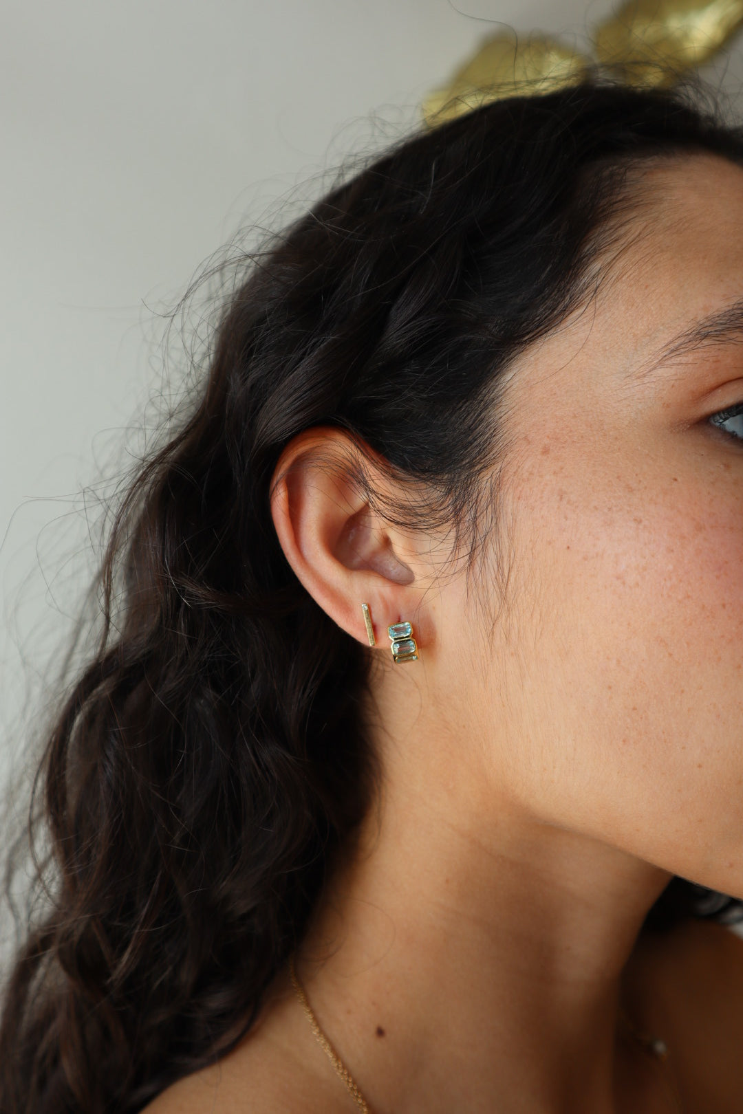 Sunset Huggie Hoops in Aqua farther back side view