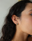 Sunset Huggie Hoops in Aqua farther back side view