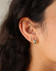 Sunset Huggie Hoops in Aqua close up side view
