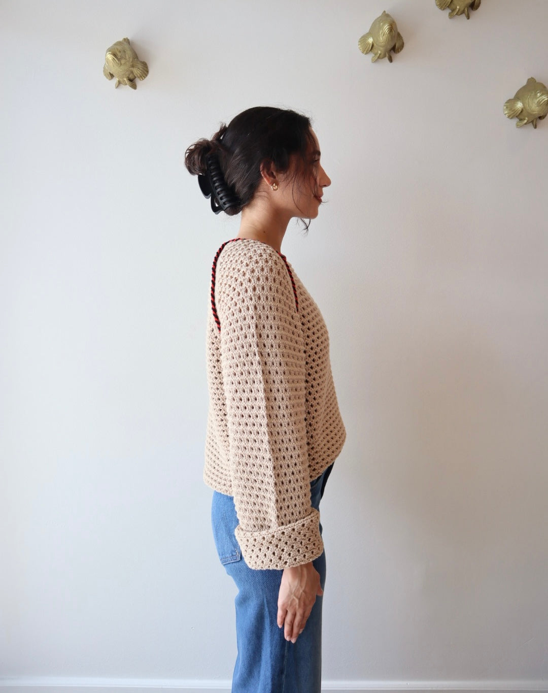Avra Sweater side view on model with sleeves cuffed