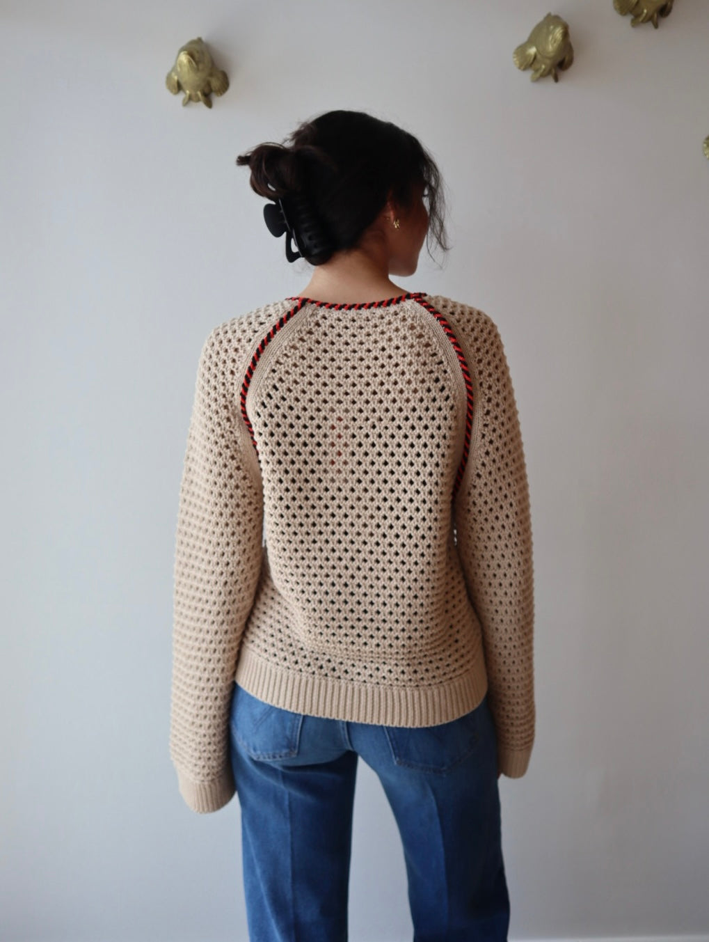 Avra Sweater back view on model with sleeves uncuffed