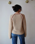 Avra Sweater back view on model with sleeves uncuffed