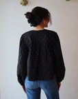 Adelle Top in Black back view on model