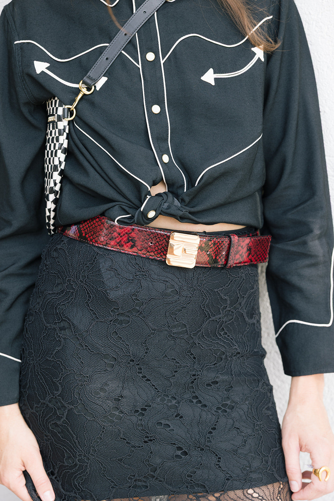 Snake Print Leather Logo Belt with lace skirt close up