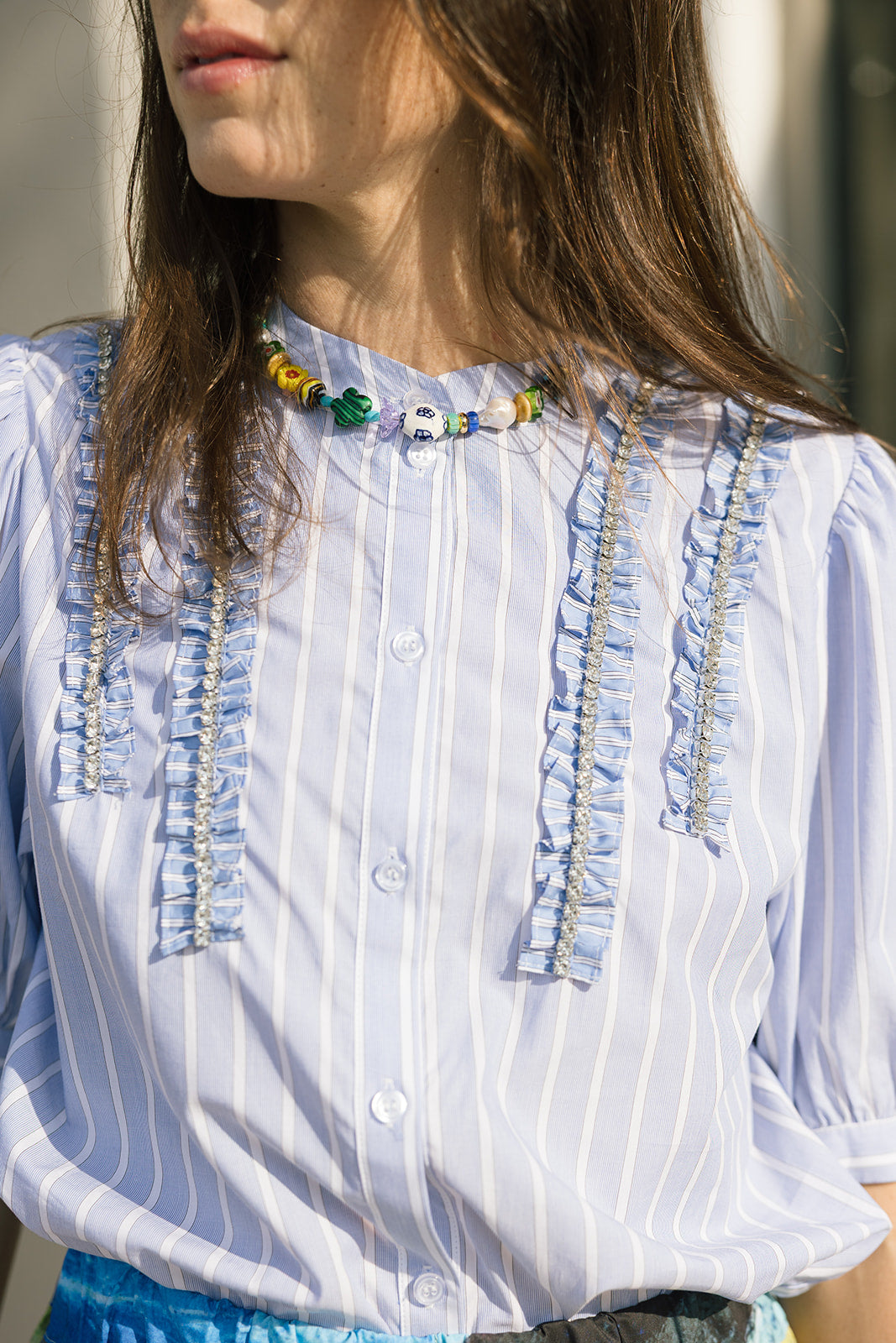 Emily Collar close up with blue top