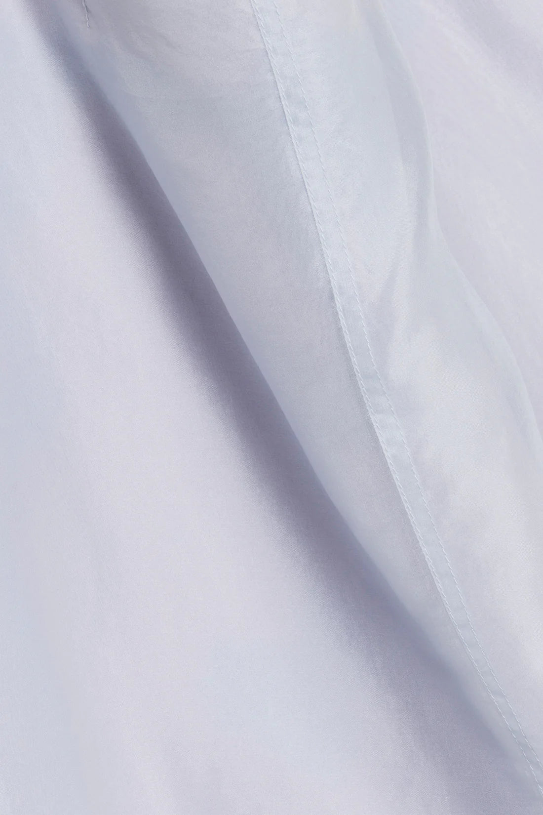 Close-up of light blue fabric with subtle texture