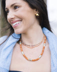 By the Sea Necklace in Terracotta close up view with other necklaces